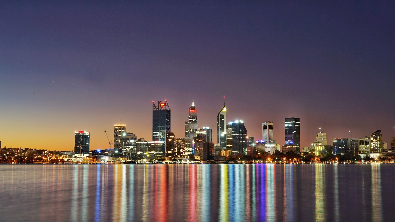 Beautiful twilight view of Perth city skyline reflecting in the water.